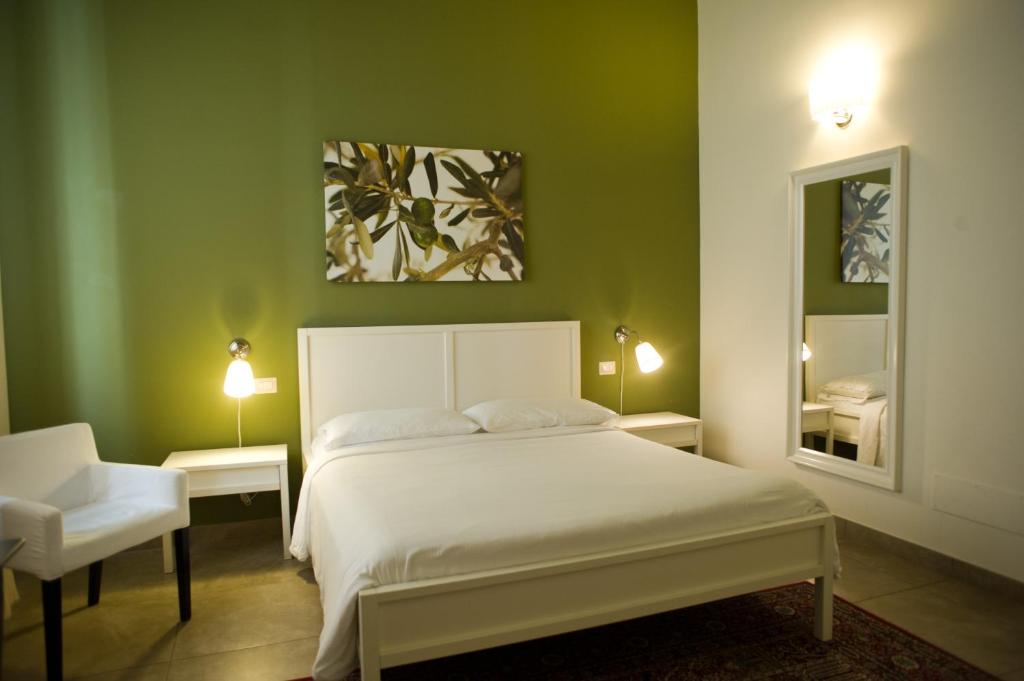 Postel nebo postele na pokoji v ubytování B&B Suite Paciotti