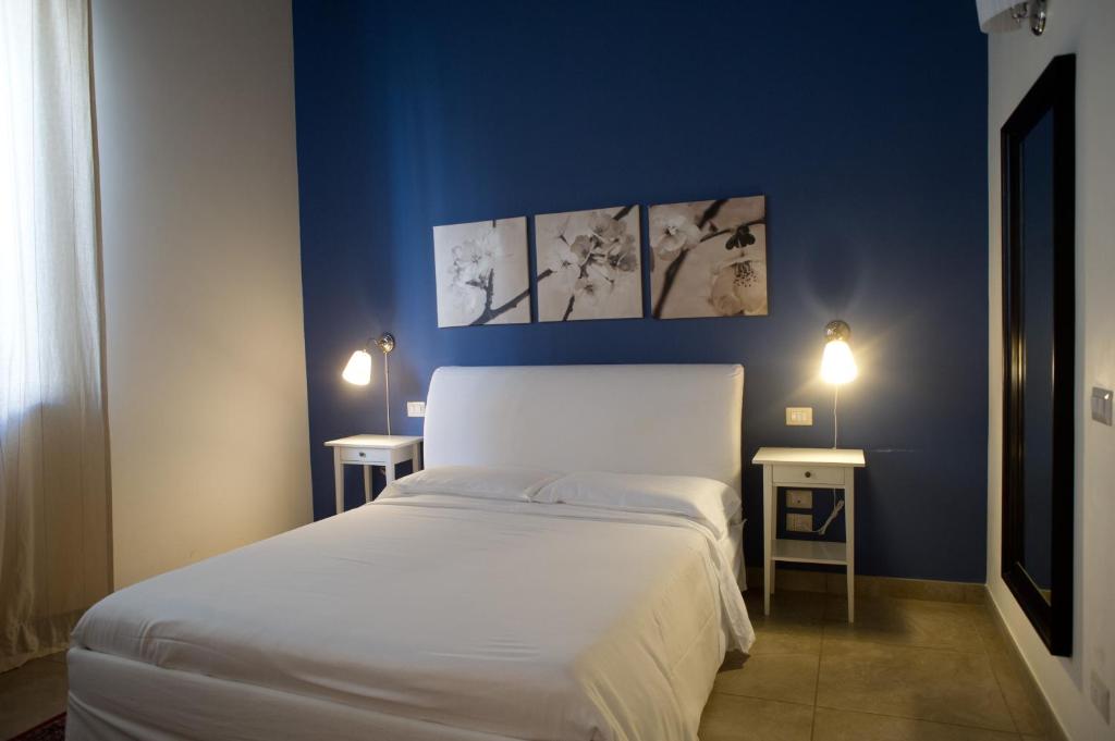 Postel nebo postele na pokoji v ubytování B&B Suite Paciotti