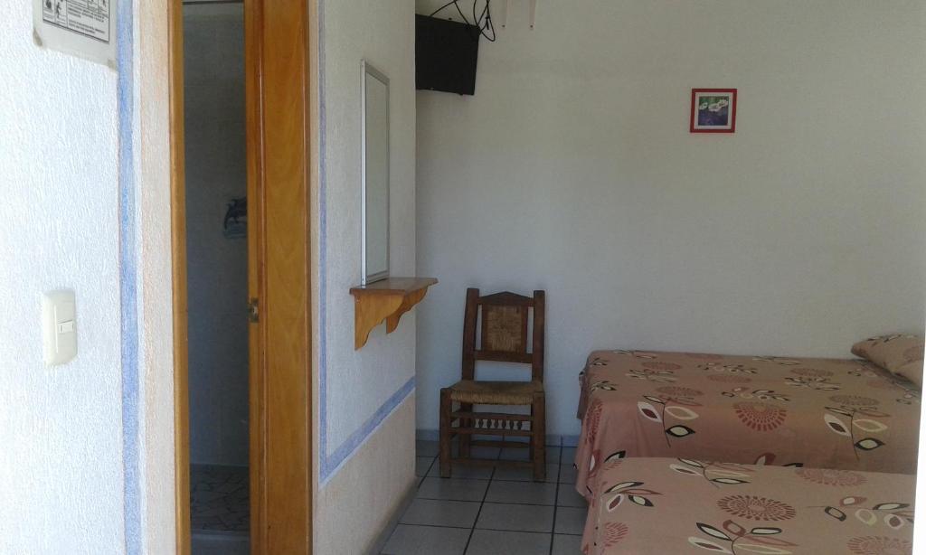 Postel nebo postele na pokoji v ubytování Hotel Sarabi