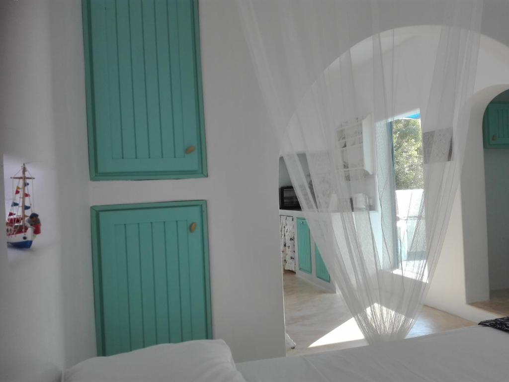 Postel nebo postele na pokoji v ubytování Tilos Island house