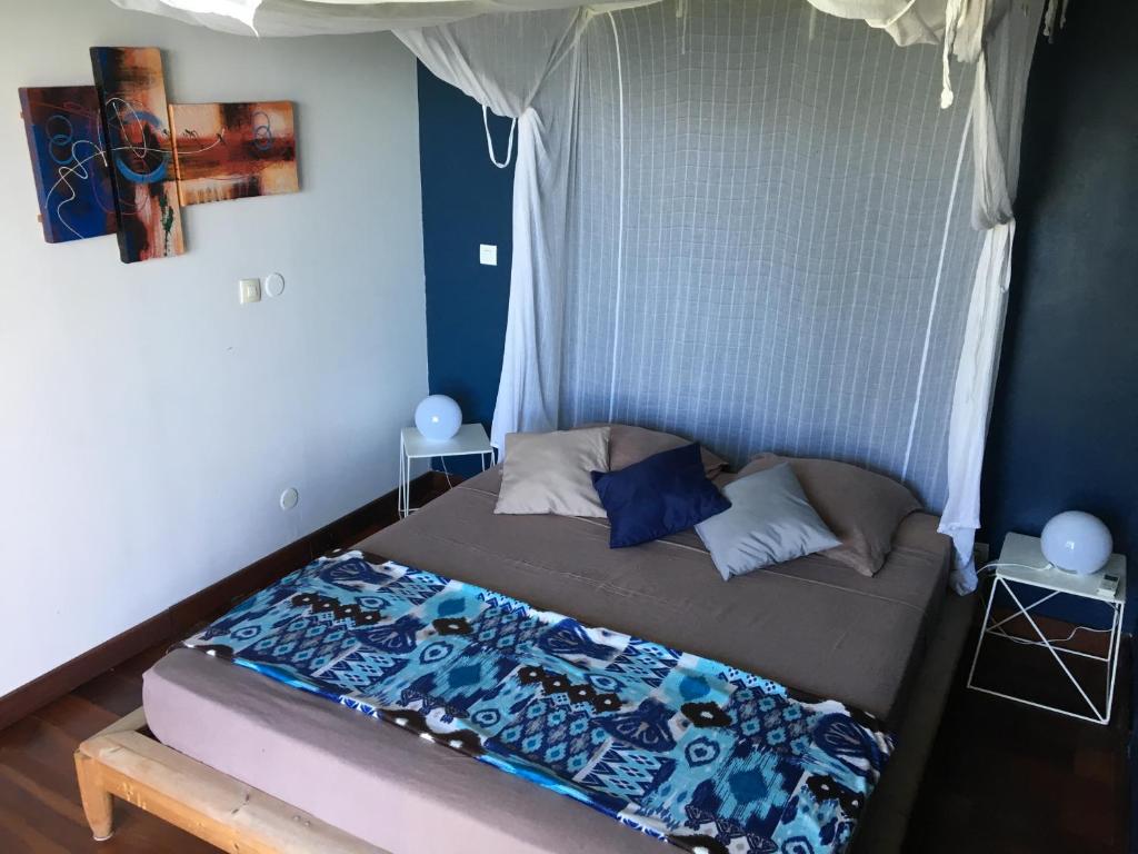 Postel nebo postele na pokoji v ubytování Villa Cajou chambres d'hôtes chez l'habitant et Zanzibar cottage