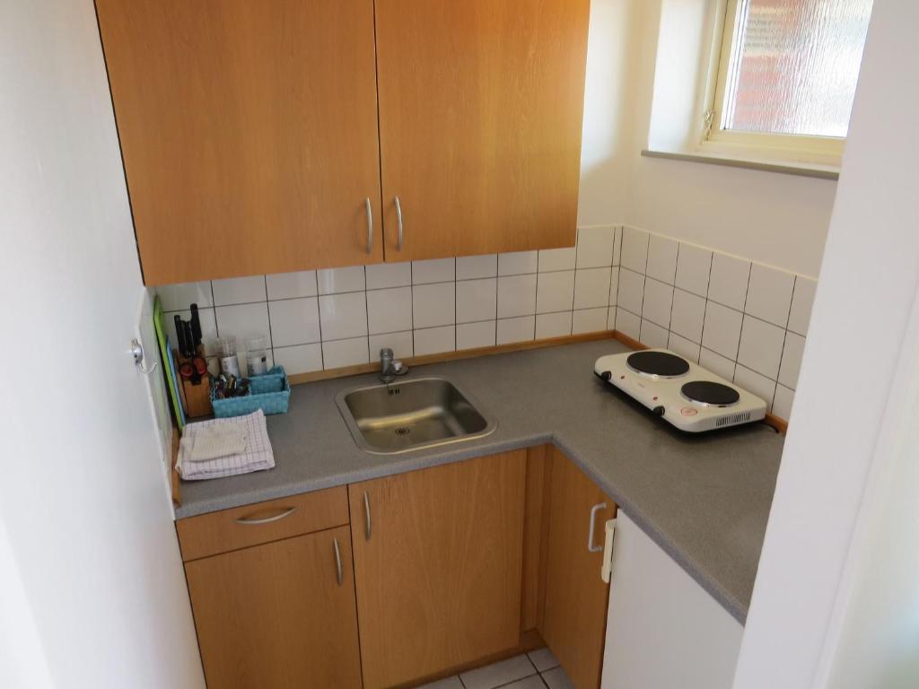 Kuchyň nebo kuchyňský kout v ubytování Motel Garni Blåvand