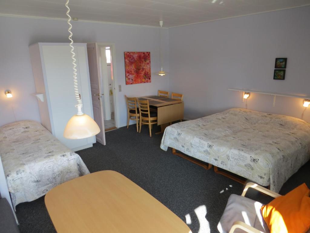 Postel nebo postele na pokoji v ubytování Motel Garni Blåvand