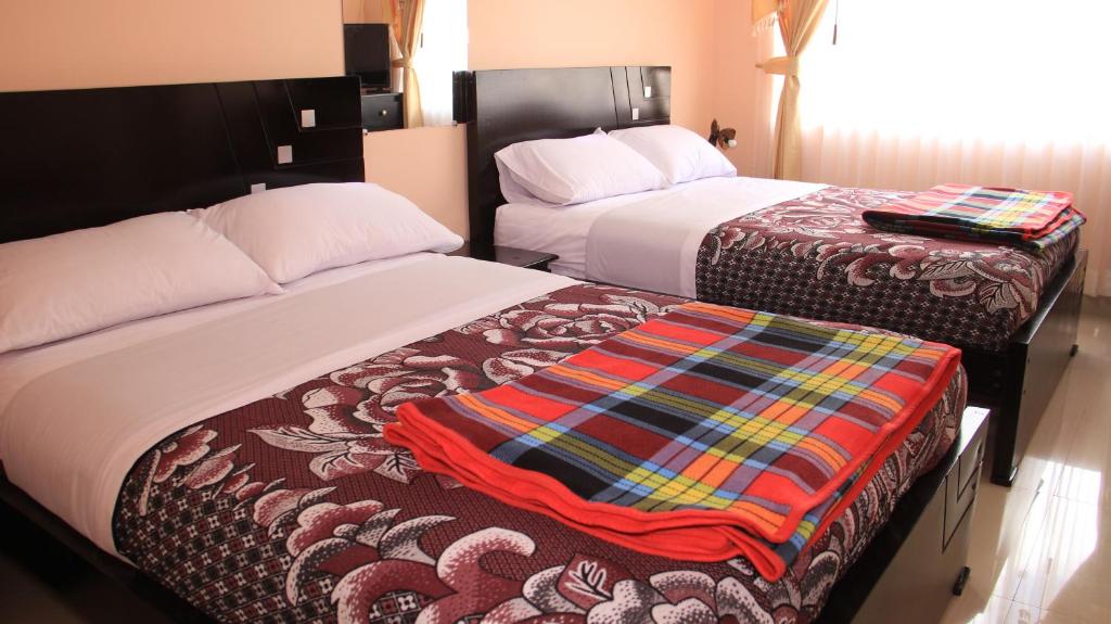 Postel nebo postele na pokoji v ubytování Kucha Wasi Hosteria