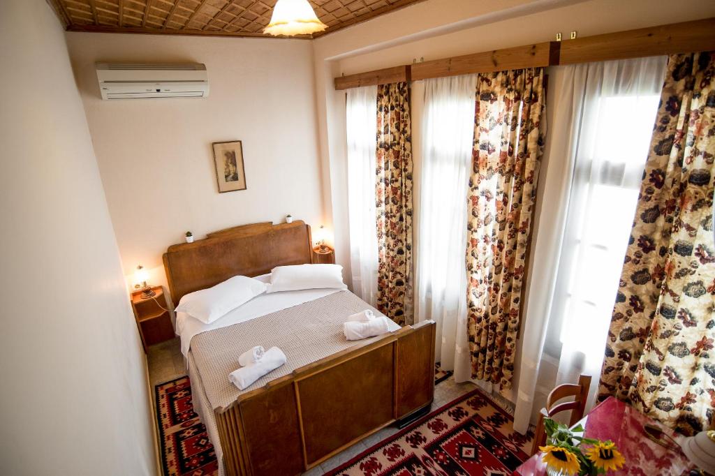 Postel nebo postele na pokoji v ubytování Hotel Kalemi