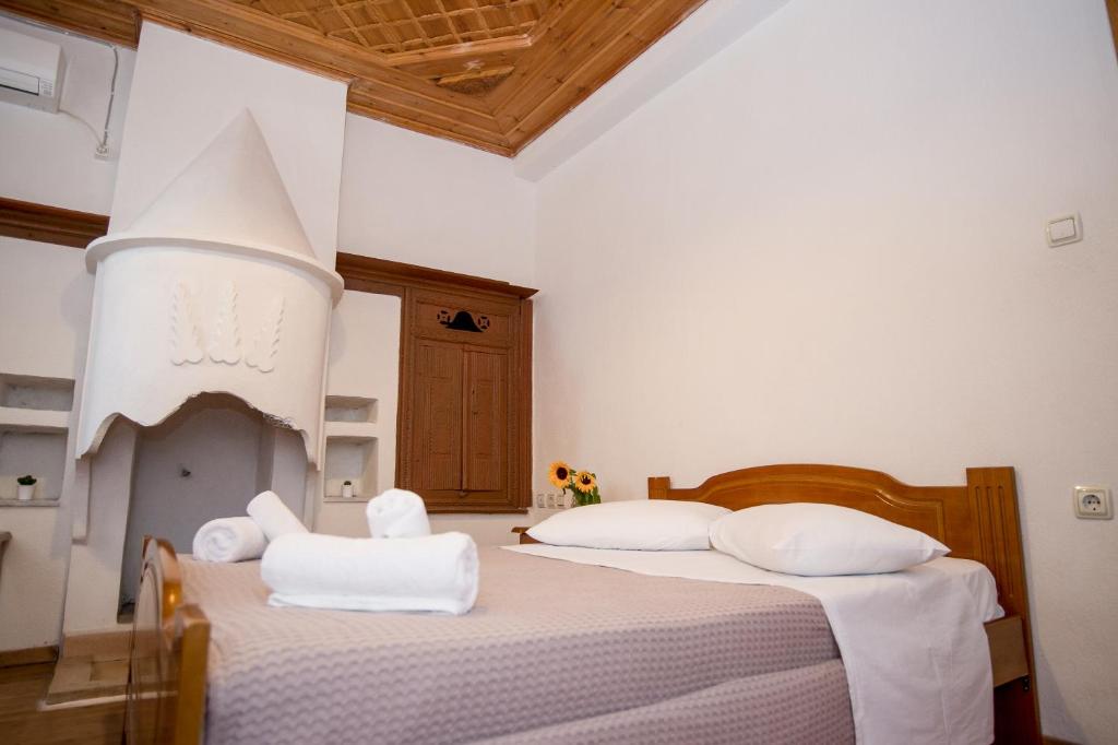 Postel nebo postele na pokoji v ubytování Hotel Kalemi