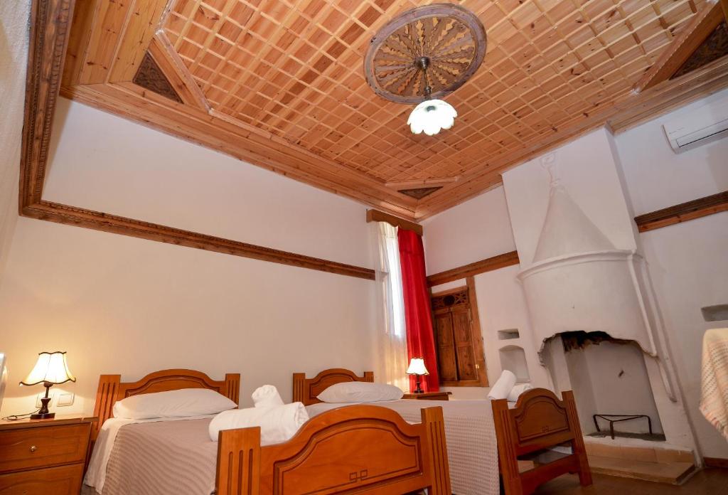 Postel nebo postele na pokoji v ubytování Hotel Kalemi
