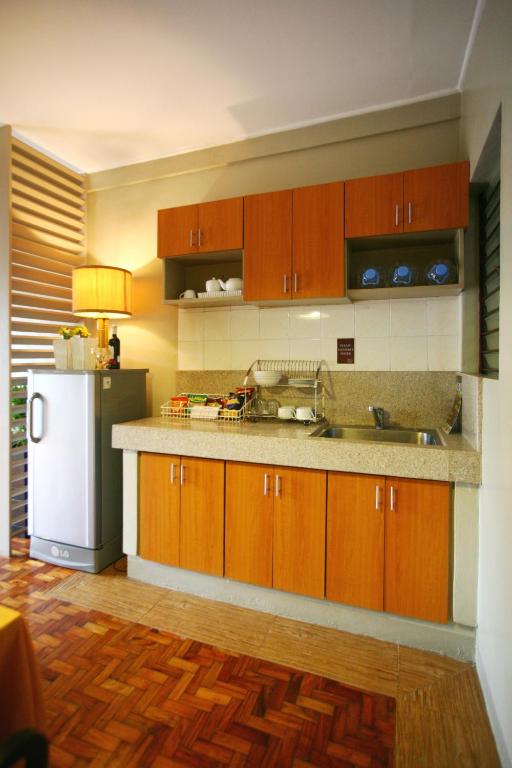 Kuchyň nebo kuchyňský kout v ubytování Baguio Holiday Villas