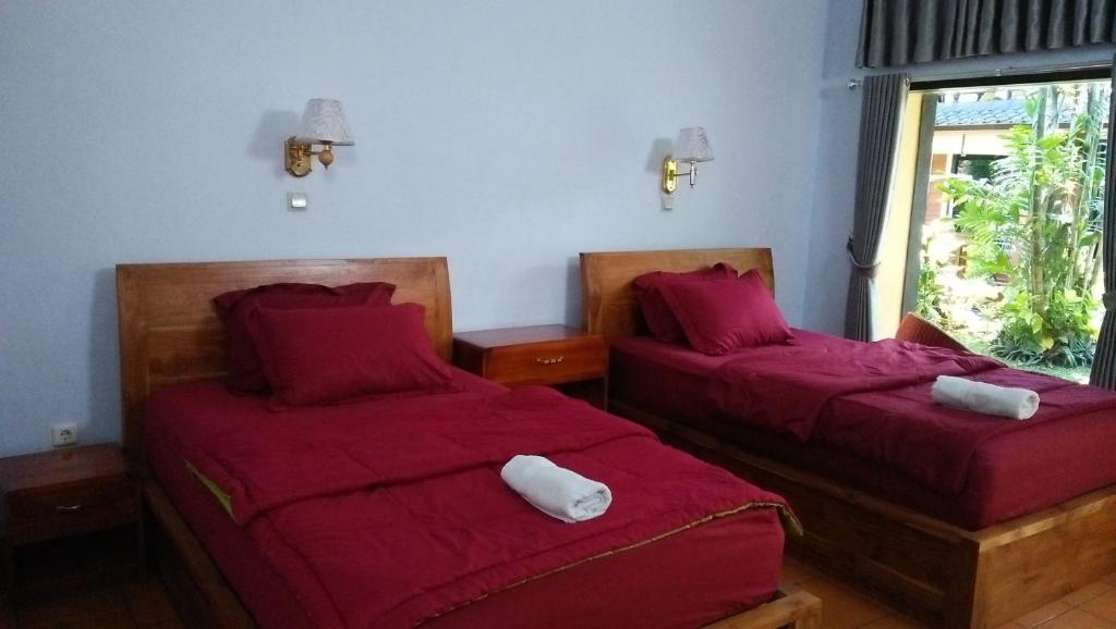 Postel nebo postele na pokoji v ubytování The Arya guest house