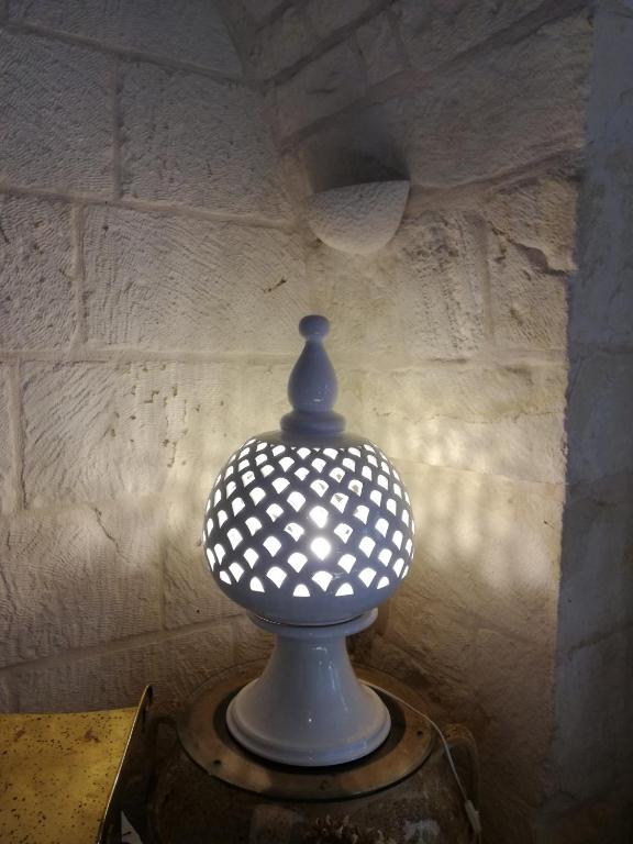 a blue and white vase sitting on a table at Masseria Asciano in Ostuni