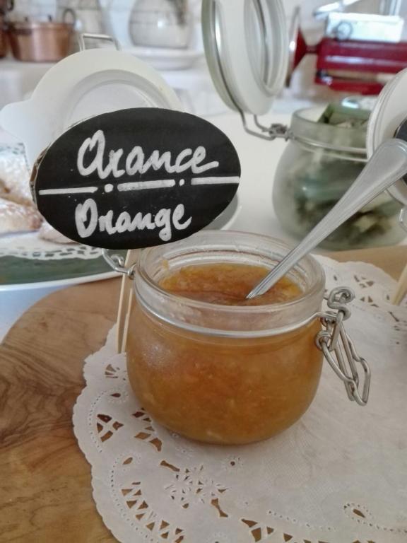 a jar of orange dipping sauce on a table at Masseria Asciano in Ostuni