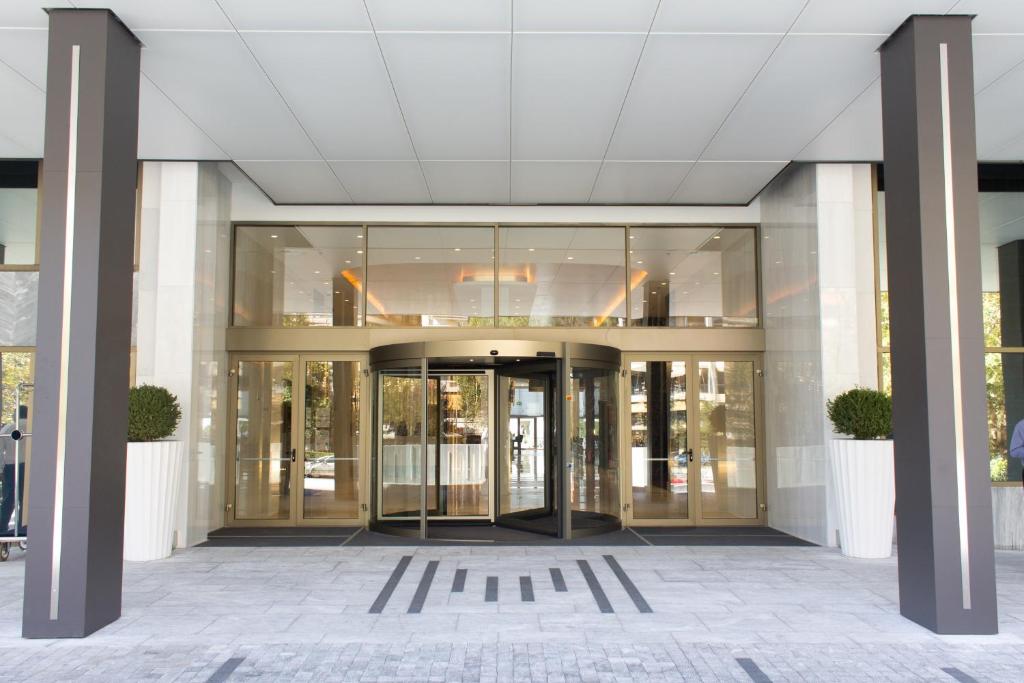 an entrance to a building with glass doors at Makedonia Palace in Thessaloniki