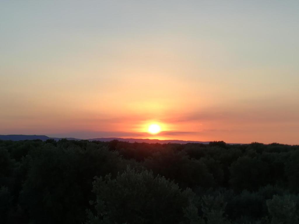 a sunset from the top of a hill at Masseria Asciano in Ostuni