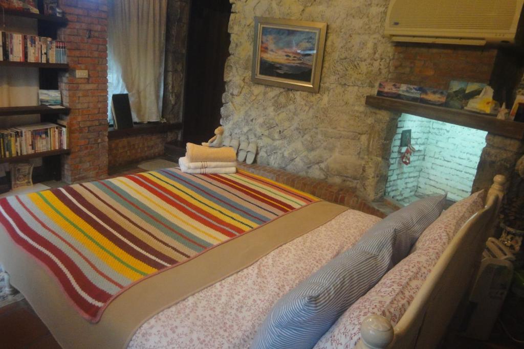 Postel nebo postele na pokoji v ubytování Jiufen Aromatherapy B&B