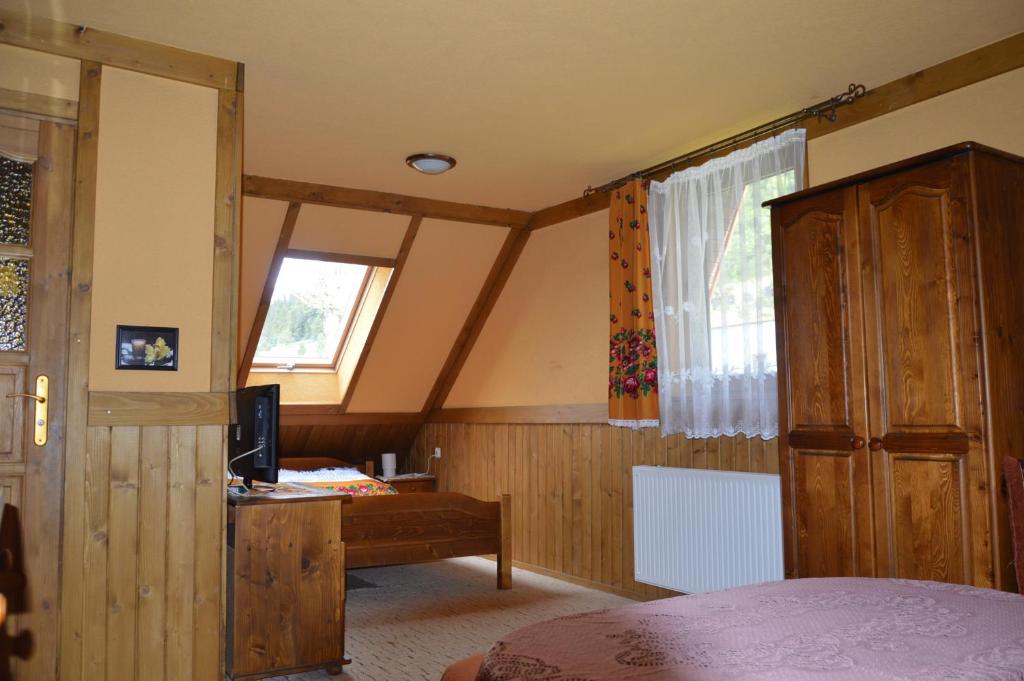 Tempat tidur dalam kamar di Willa Janosik