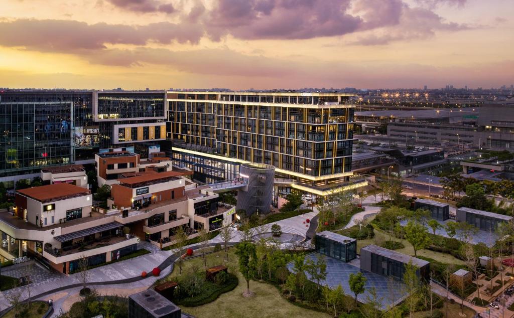 a large building with a view of a city at Cordis Shanghai Hongqiao (Langham Hospitality Group) in Shanghai