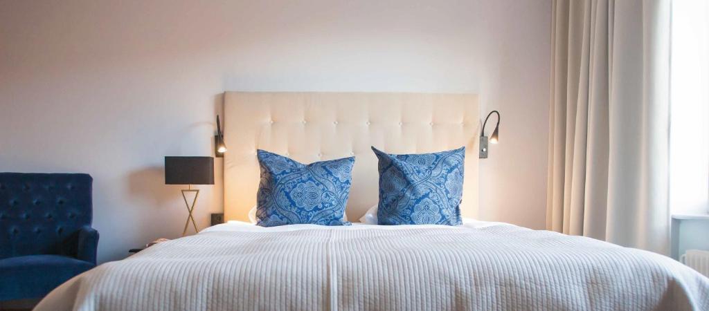 Postel nebo postele na pokoji v ubytování Home Hotel Smedjan