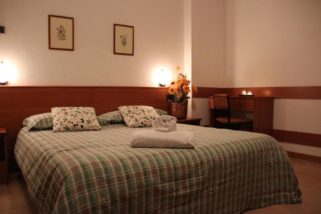 Postel nebo postele na pokoji v ubytování Albergo Bucaneve