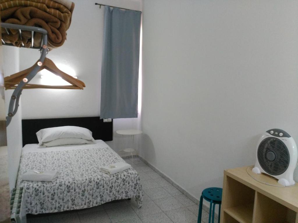 Postel nebo postele na pokoji v ubytování Hostal River
