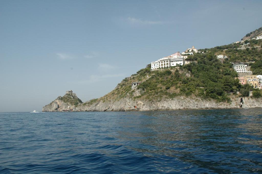 a view of an island from the water at Hotel Belvedere in Conca dei Marini
