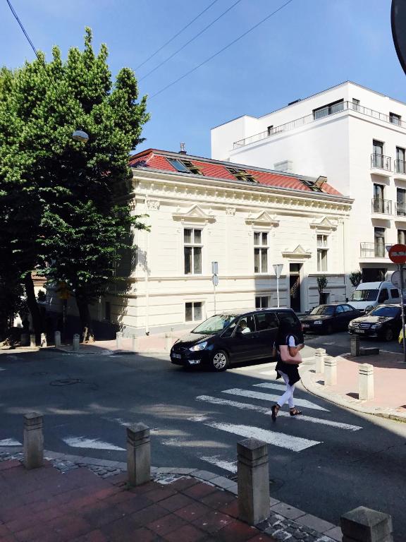 a person crossing a street in a cross walk at Smokvica Dorćol B&B in Belgrade