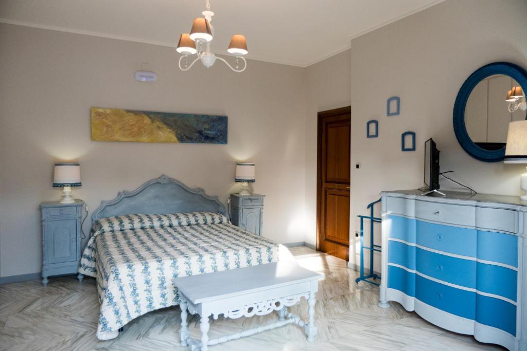 Łóżko lub łóżka w pokoju w obiekcie Yucca Camere & Suite