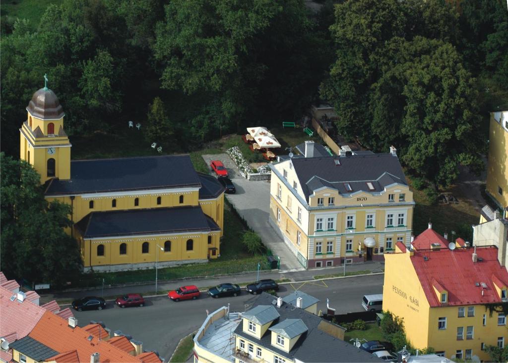 an aerial view of a town with a church and a street at Pension Abbazia in Františkovy Lázně
