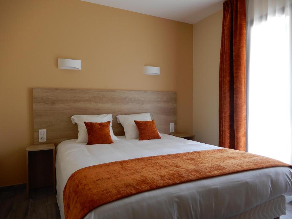 Postel nebo postele na pokoji v ubytování Hotel Marinet