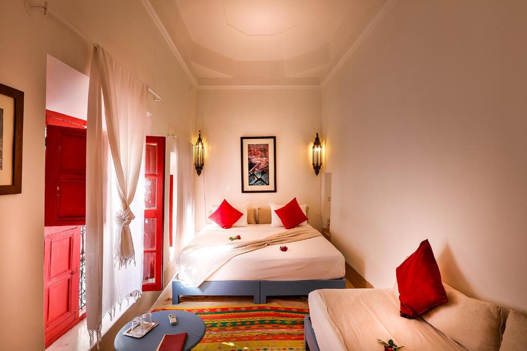 Postel nebo postele na pokoji v ubytování Hotel & Spa Dar Baraka & Karam