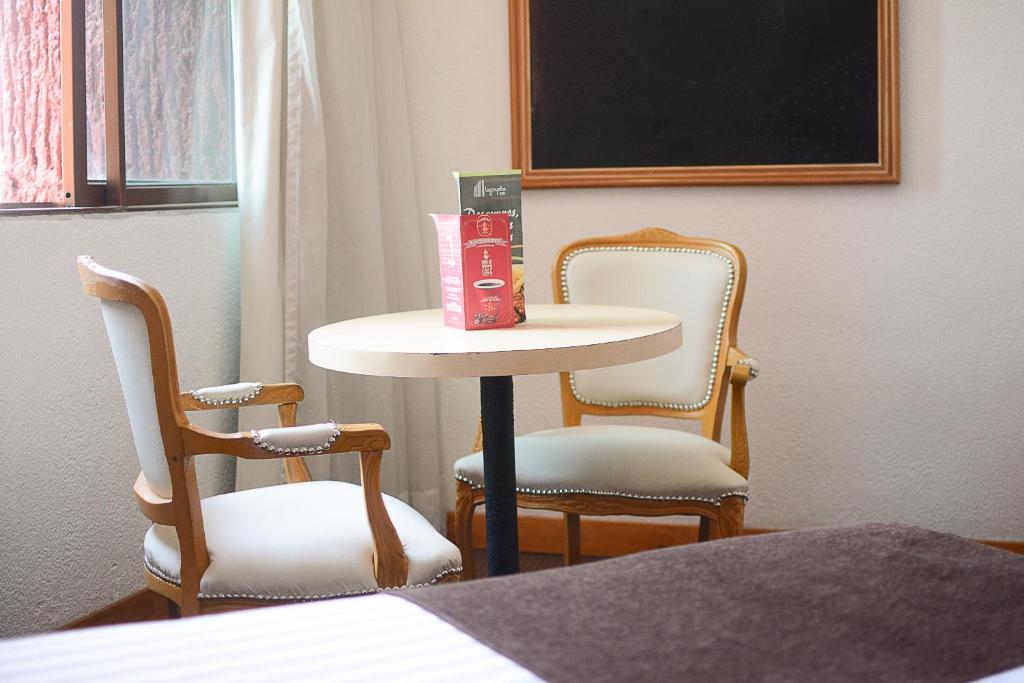 Postel nebo postele na pokoji v ubytování Hotel Laffayette Ejecutivo