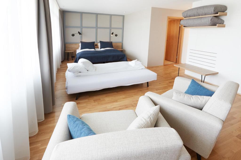 Postel nebo postele na pokoji v ubytování Fosshotel Reykholt