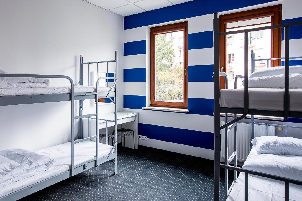 Posteľ alebo postele v izbe v ubytovaní Inbed Hostel