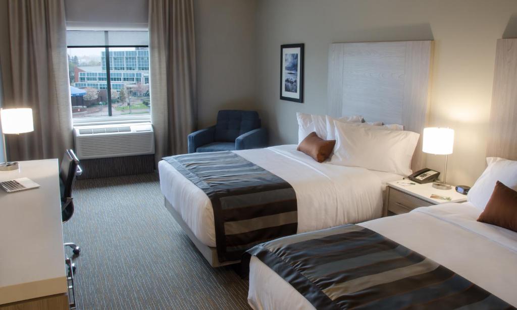 Postel nebo postele na pokoji v ubytování Wingate by Wyndham Dieppe Moncton
