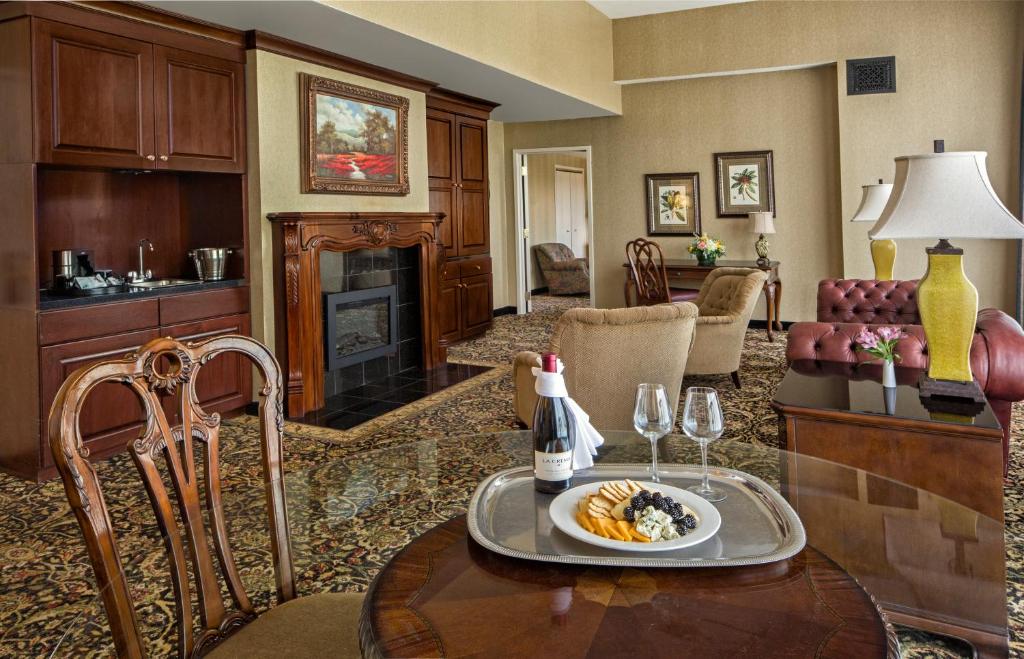 a living room with a table with a plate of food at Carnegie Hotel & Spa in Johnson City