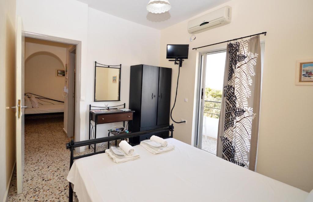 Postel nebo postele na pokoji v ubytování Koukounari 2 Rooms