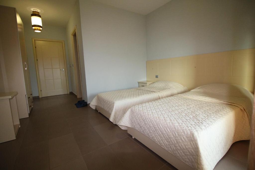 Postel nebo postele na pokoji v ubytování Hotel Piazza