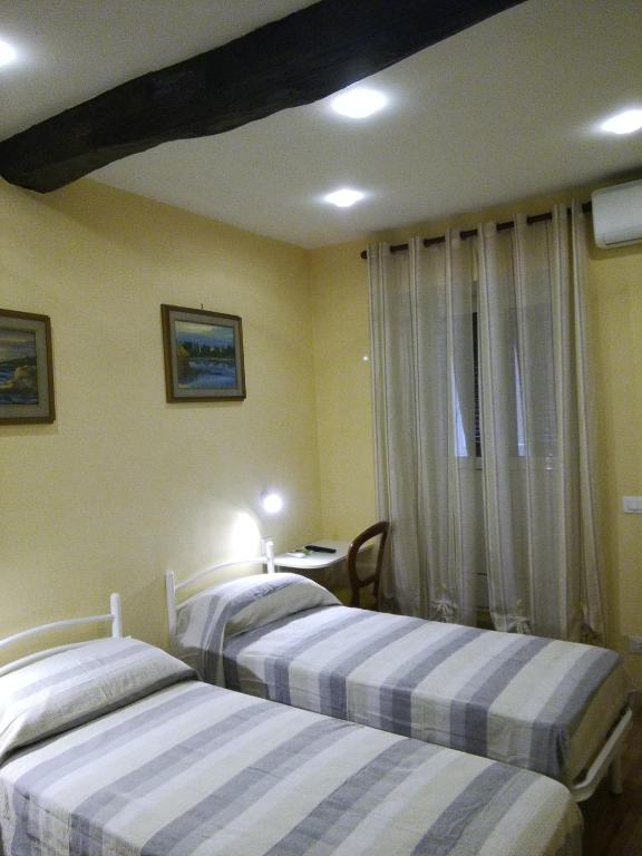 Postel nebo postele na pokoji v ubytování Casa di Stella