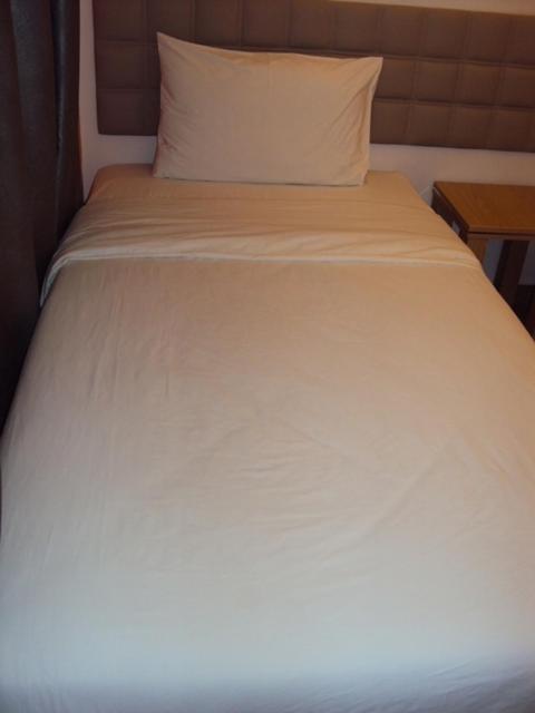 Postel nebo postele na pokoji v ubytování GM City Hotel