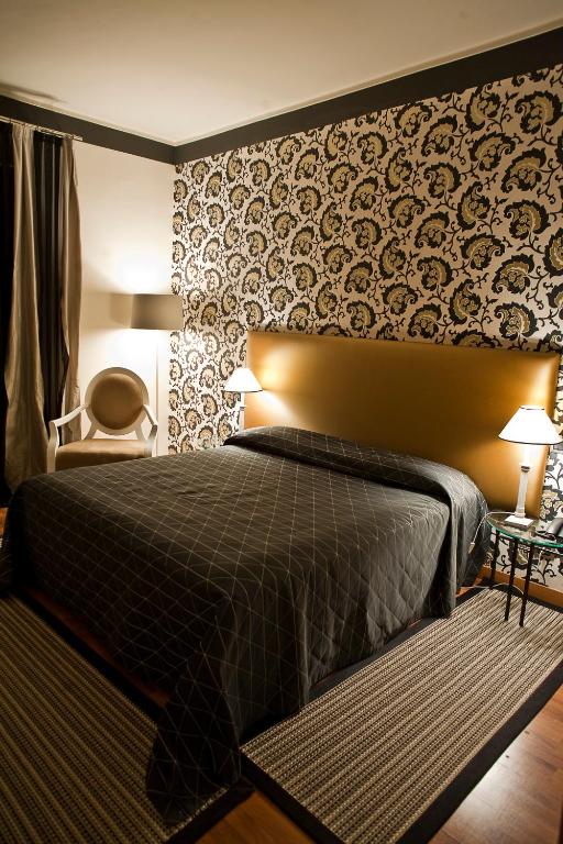 Postel nebo postele na pokoji v ubytování Hotel Aleramo
