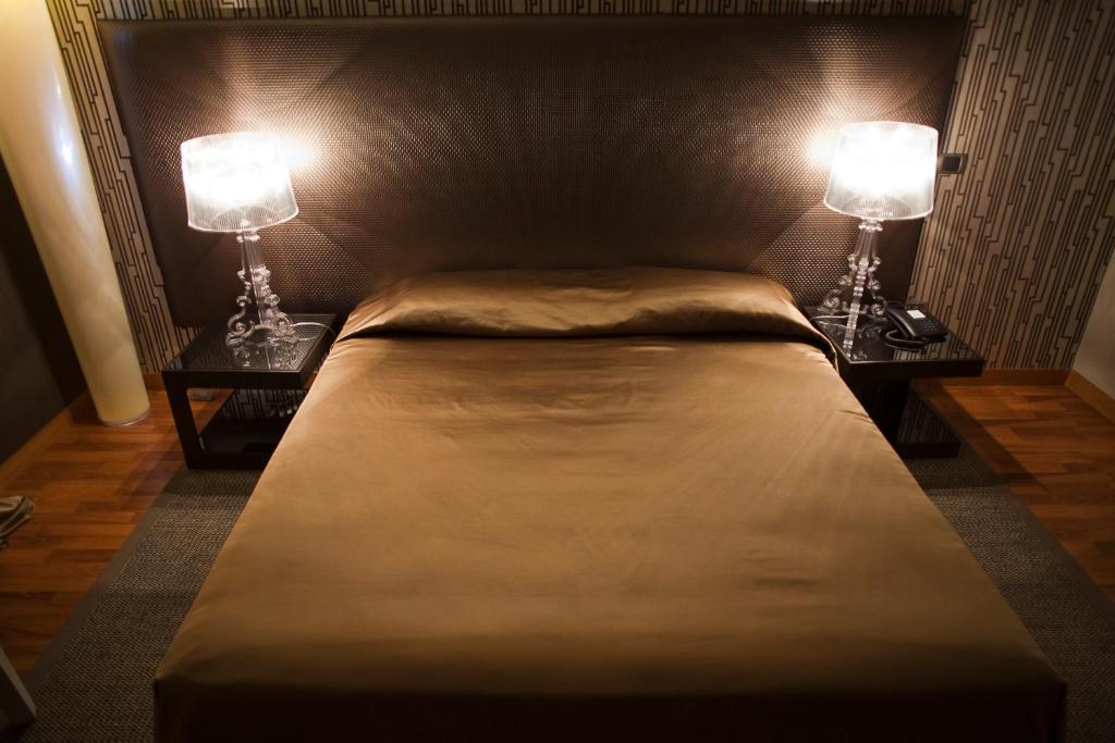 Postel nebo postele na pokoji v ubytování Hotel Aleramo