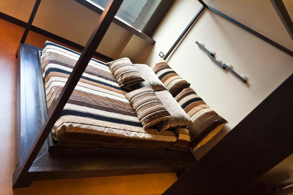 Postel nebo postele na pokoji v ubytování Hotel Aleramo