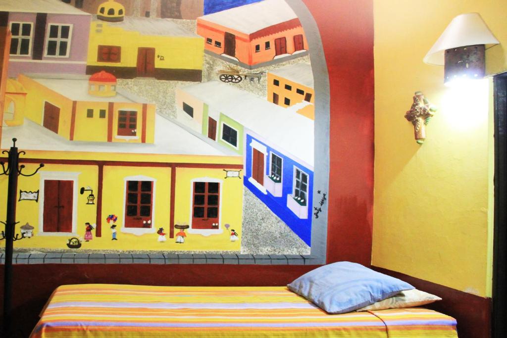 Postel nebo postele na pokoji v ubytování Hostel Casa Zalaoui