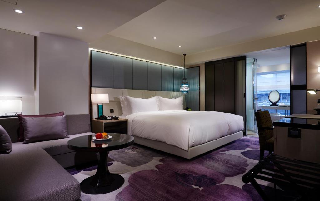 Postel nebo postele na pokoji v ubytování Taipei Fullerton Hotel-Maison North