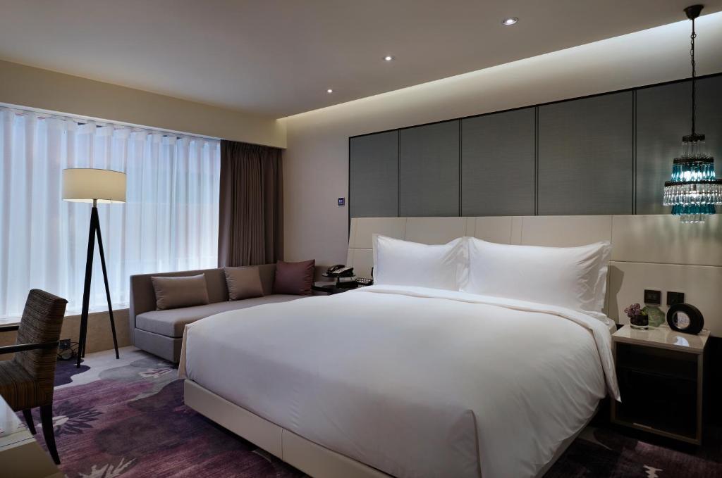 Postel nebo postele na pokoji v ubytování Taipei Fullerton Hotel-Maison North
