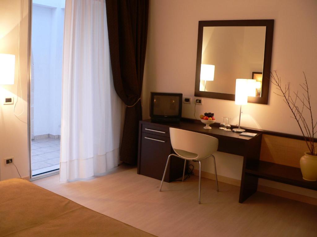 Postel nebo postele na pokoji v ubytování Il Grillo Hotel