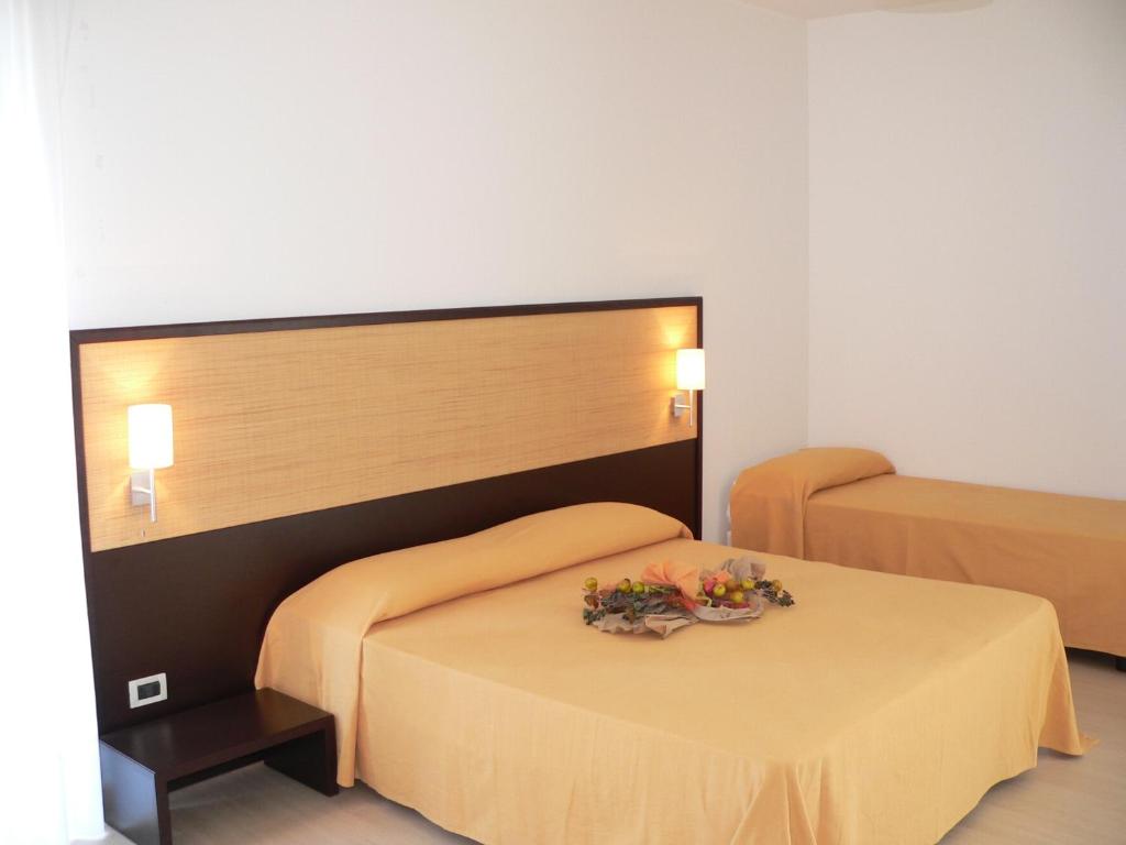 Postel nebo postele na pokoji v ubytování Il Grillo Hotel