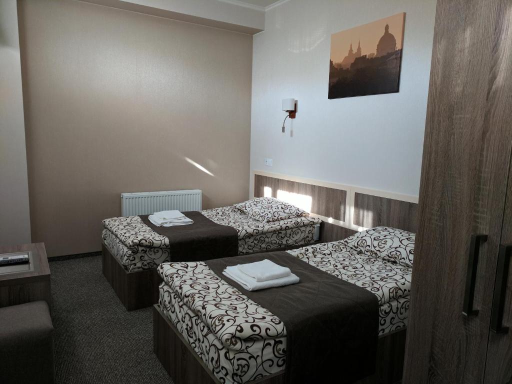 Postel nebo postele na pokoji v ubytování Art Hotel Palma