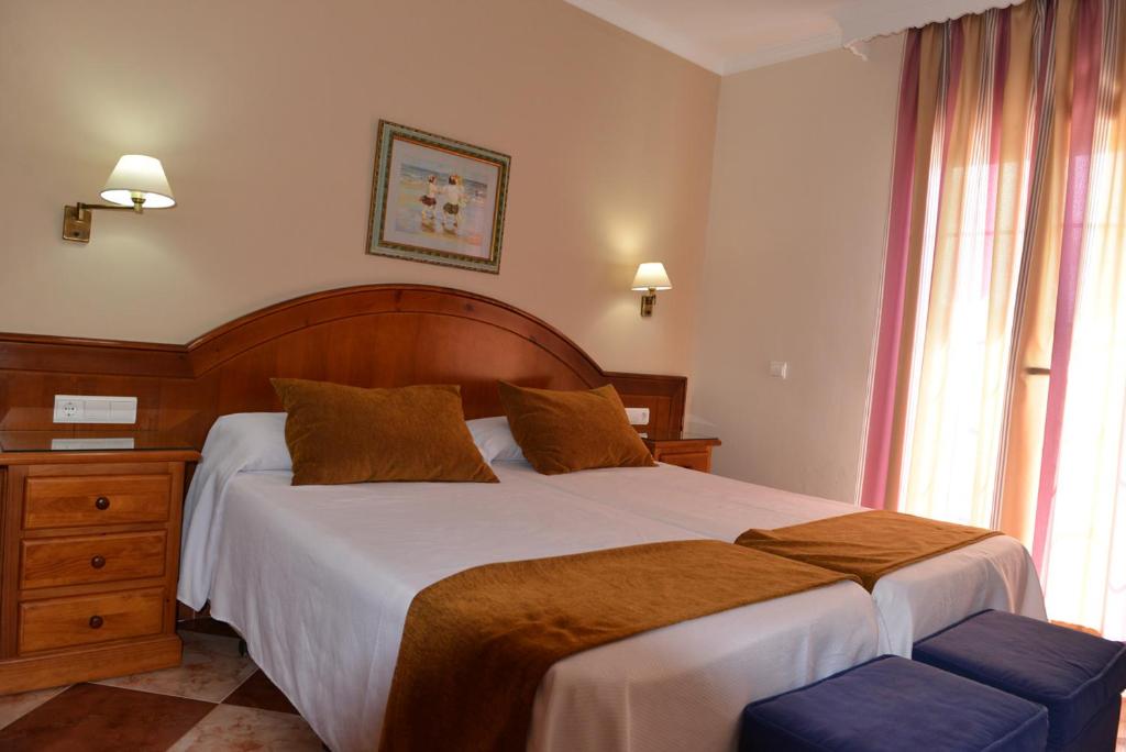 Posteľ alebo postele v izbe v ubytovaní Hostal Cabo Roche
