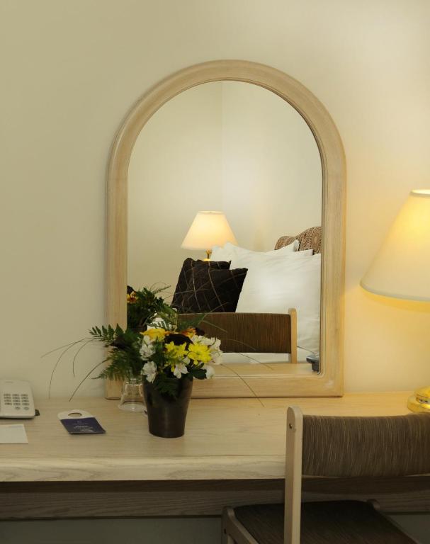 Postel nebo postele na pokoji v ubytování Airport Hotel Mara