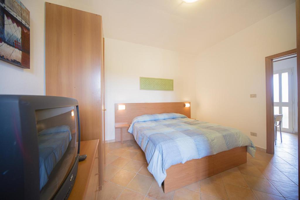 Een bed of bedden in een kamer bij Bonsai B&B Alghero